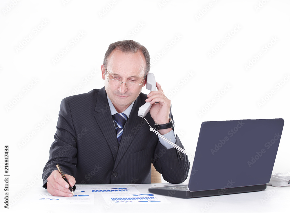 businessman talking on the phone and checks the financial report businessman talking on the phone and checks the financial report