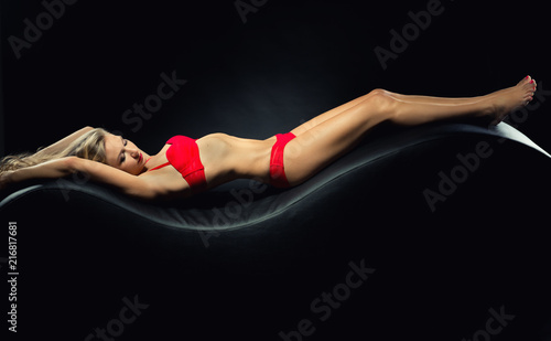 Seductive woman in lingerie posing indoors