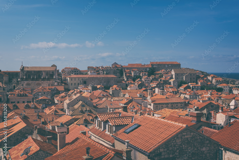 Red tiled roofs of Dubrovnik Old Town, view from the ancient city wall. The world famous and most visited historic city of Croatia, UNESCO World Heritage site, vintage image