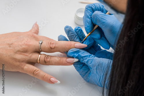 Beautiful manicure, women's hands, handbag