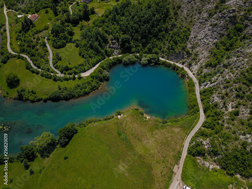 Fototapeta Naklejka Na Ścianę i Meble -  The Gornjepolje Spring (Gornjepoljski Vir) is a huge karst spring in the Central Montenegro. It is a natural phenomenon called an estavelle, as spring becomes sinkhole / ponor during low waters.