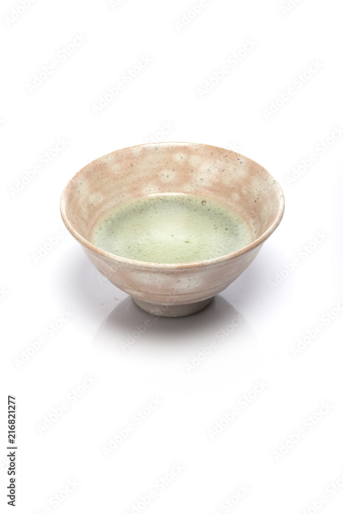 green tea with a ceramic bowl isolated white. green tea with a ceramic bowl isolated white.