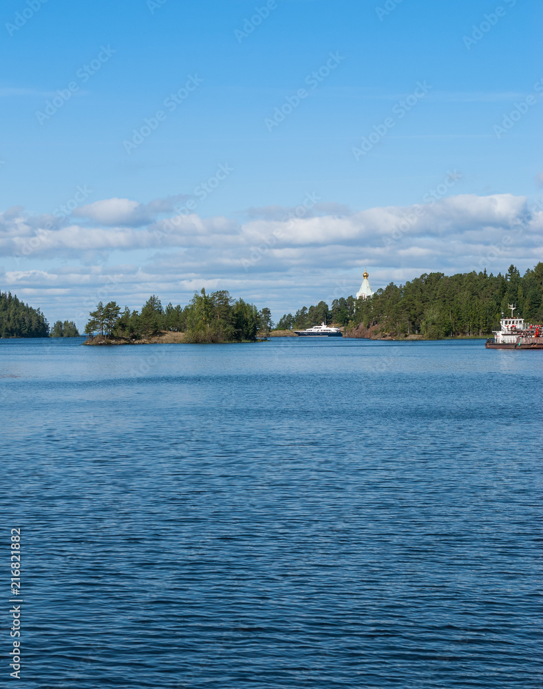 The panorama of the Bay on the island with ships and a Church far away on the island