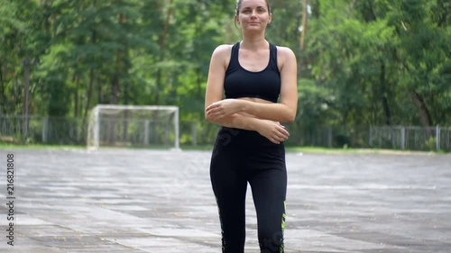 Young Athlete Woman in Sport Outfit Engaged in Fitness on the Sports Field in the Park. photo