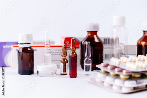 Pharmaceutical colorful pills, capsules, ampoules  on white background