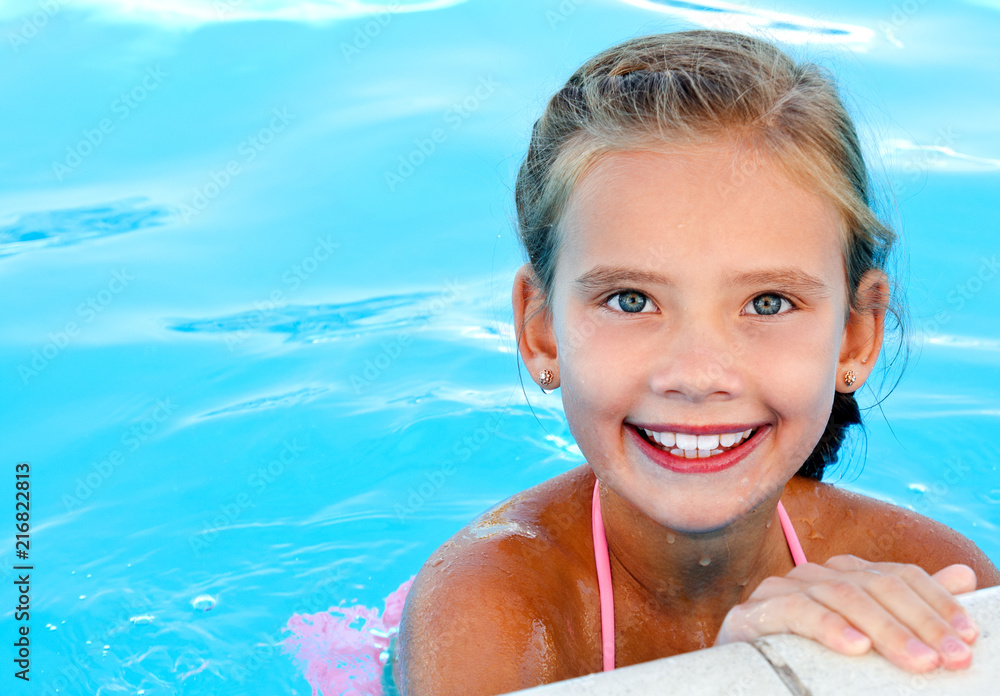 Cute smiling happy little girl child in swimming pool Stock Photo ...