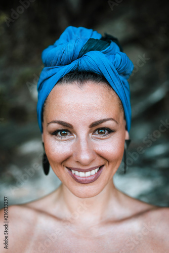 Headshot of a gorgeous smilling woman with headscarf. Real emotions.