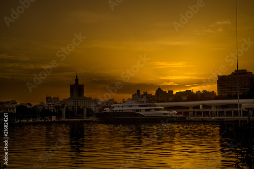 Spain, Malaga, a sunset over a body of water