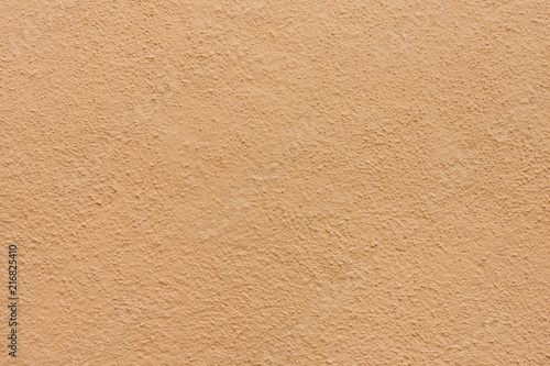 Stucco wall - Brown beige stucco textured wall background with natural light.