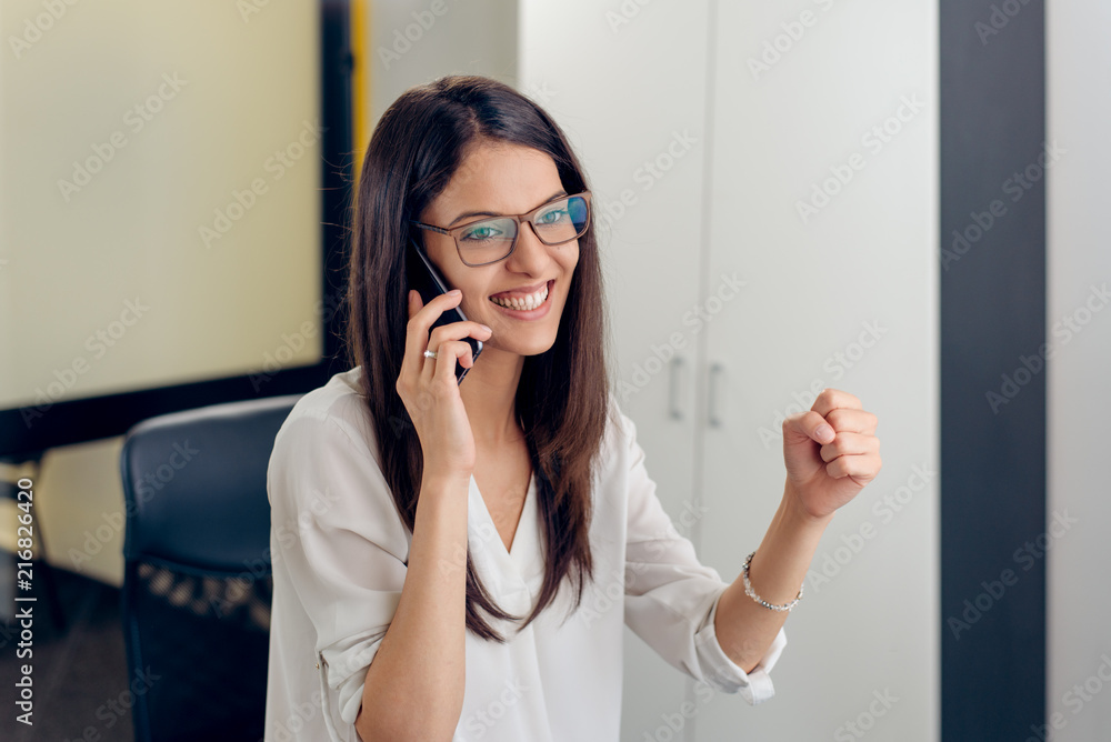 Excited executive reading amazing news on line Excited executive reading amazing news on line