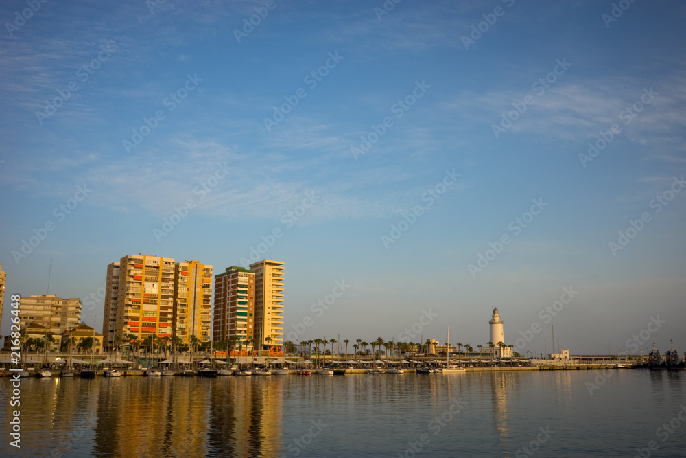 Naklejka premium Spain, Malaga, a light house at the quay bay area