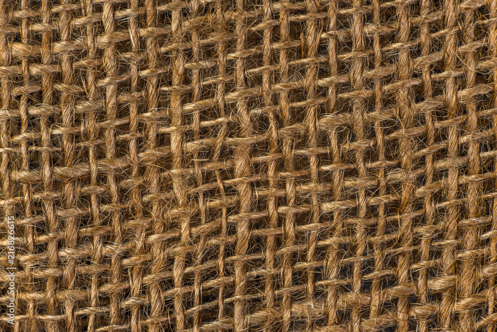 close-up texture of sackcloth, natural fabric made from jute or hemp, abstract pattern background close-up texture of sackcloth, natural fabric made from jute or hemp, abstract pattern background