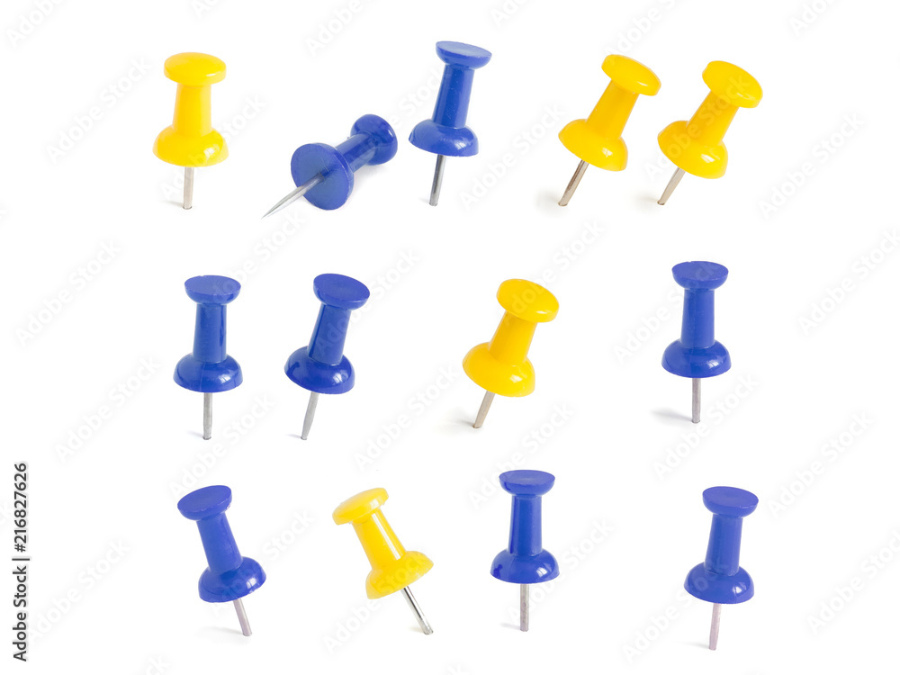 isolated blue and yellow push pins in white background isolated blue and yellow push pins in white background