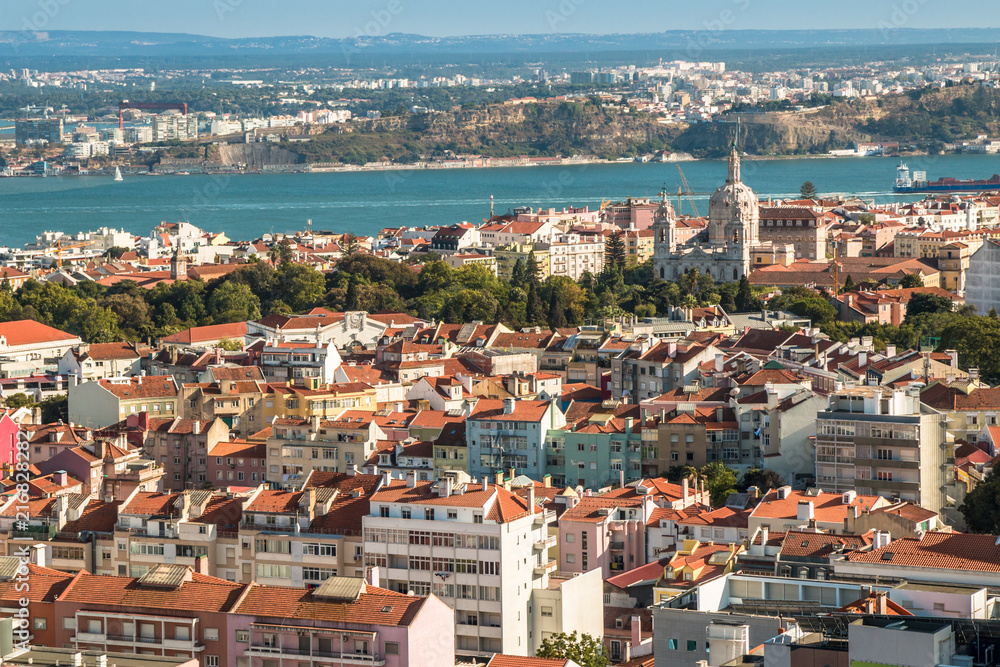 Panoramic view of Lisbon colorful rooftop from Amoreiras viewpoint towards River Tagus