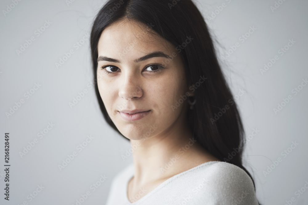 Beautiful young girl looking at camera portrait Beautiful young girl looking at camera portrait