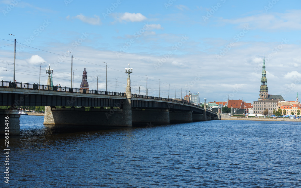 Panoramic view across Daugava river on bridge and Riga cathedral in old town, Latvia, July 25, 2018