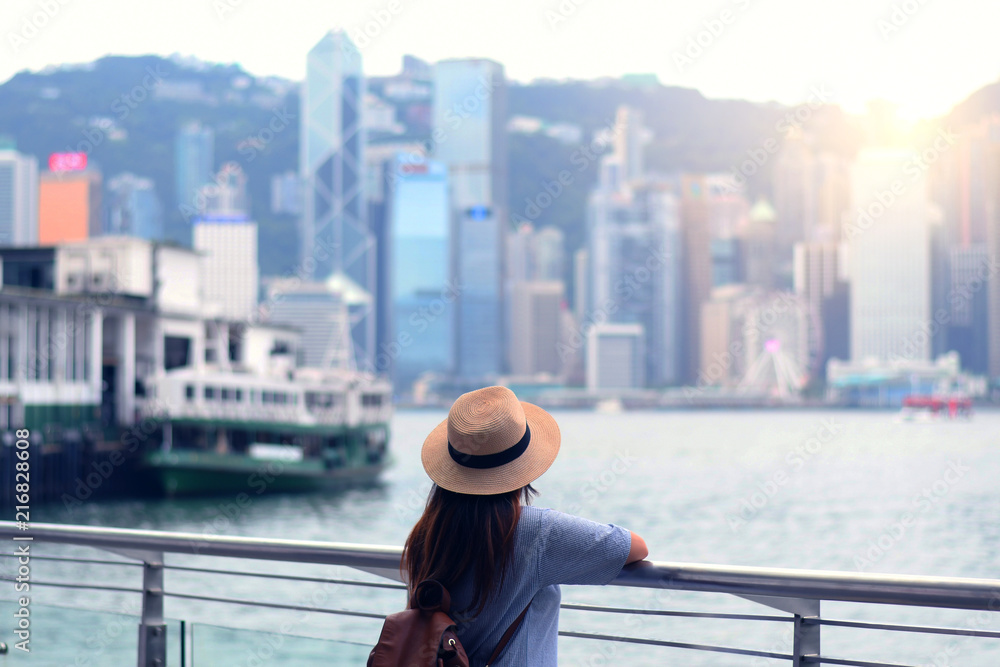 Tourist is watching beautiful view of skyscraper cityscape of Hong Kong.