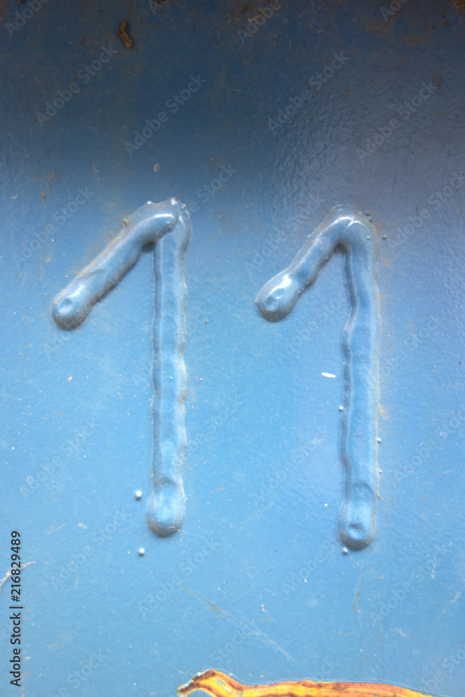 Written Wording in Distressed State Typography Found Number Eleven 11 Written Wording in Distressed State Typography Found Number Eleven 11