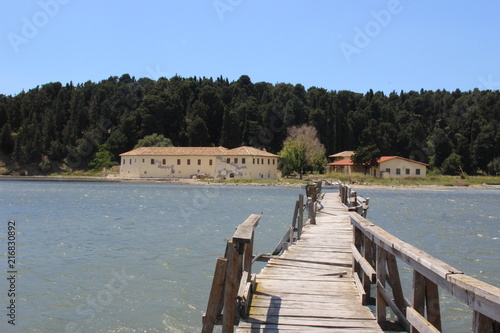  A small provisionally built bridge that leads over a river photo