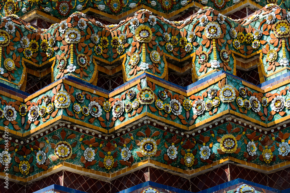 Close up beauitful mosaic tiles of large stupas in Wat Pho or Wat Phra Chetuphon Vimolmangklararm Rajwaramahaviharn is one of Bangkok's oldest temples, THAILAND