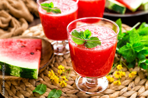 Watermelon smoothie. Watermelon drink, cocktail on wooden rustic background