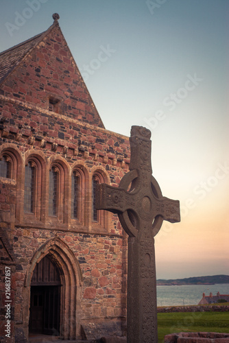 Canvas Print St John's Celtic Cross in Front of Iona Abbey at Dusk