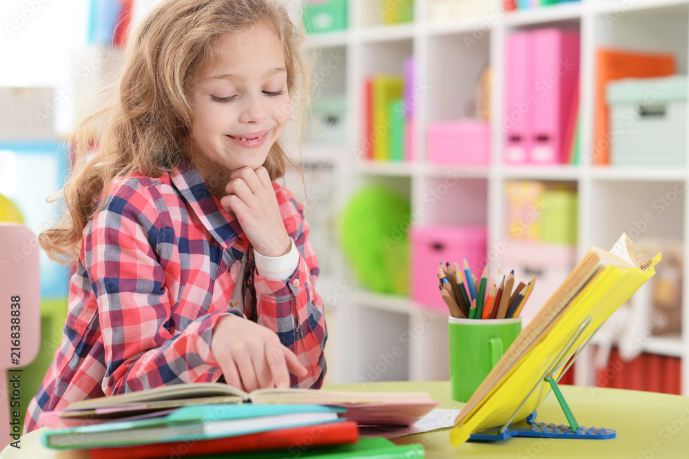 Portrait of cute little girl doing homework Portrait of cute little girl doing homework