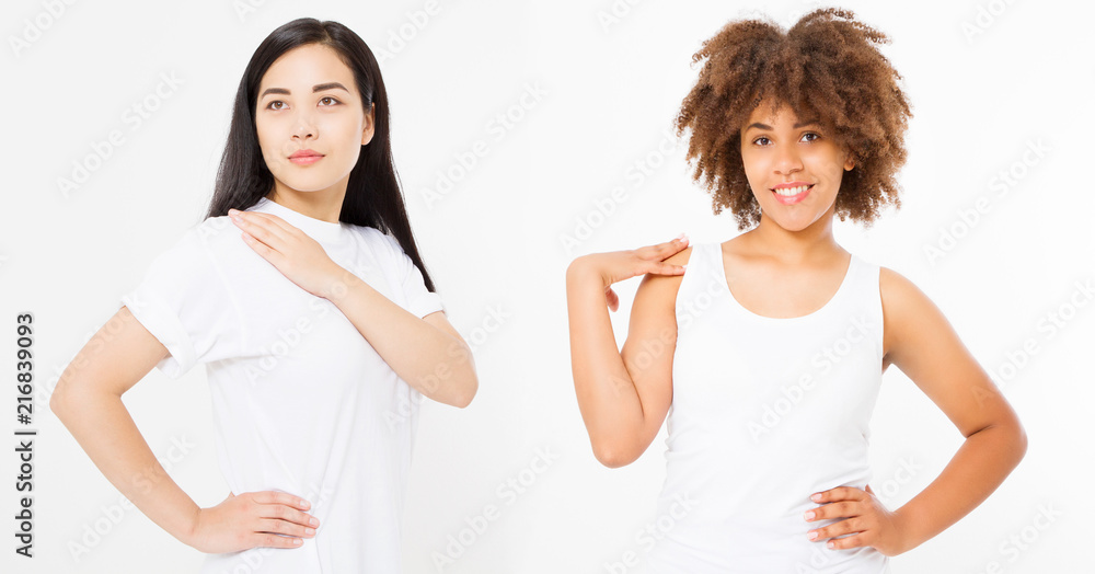 Two women isolated on white background. Asian and african american woman with healthy hair. Skin care and beauty concept. Copy space. Multinational and multi ethnic. Template blank t shirt. Two women isolated on white background. Asian and african american woman with healthy hair. Skin care and beauty concept. Copy space. Multinational and multi ethnic. Template blank t shirt.
