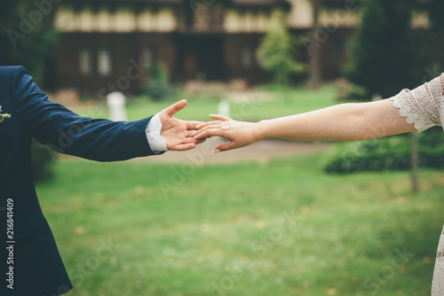 beautiful wedding couple holding hands together