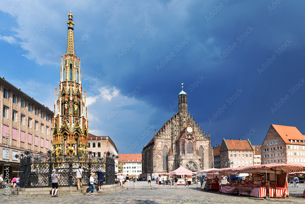 Fototapeta premium historic medieval centre - gothic Frauenkirche on Hauptmarkt, town Nuremberg, Germany, Europe