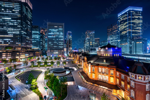 Tokyo railway station and business district building at night, Japan.