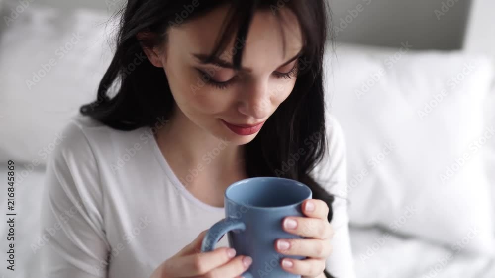 Pregnant Young Woman Drinking Tea And Sitting On Bed At Home Pregnant Young Woman Drinking Tea And Sitting On Bed At Home