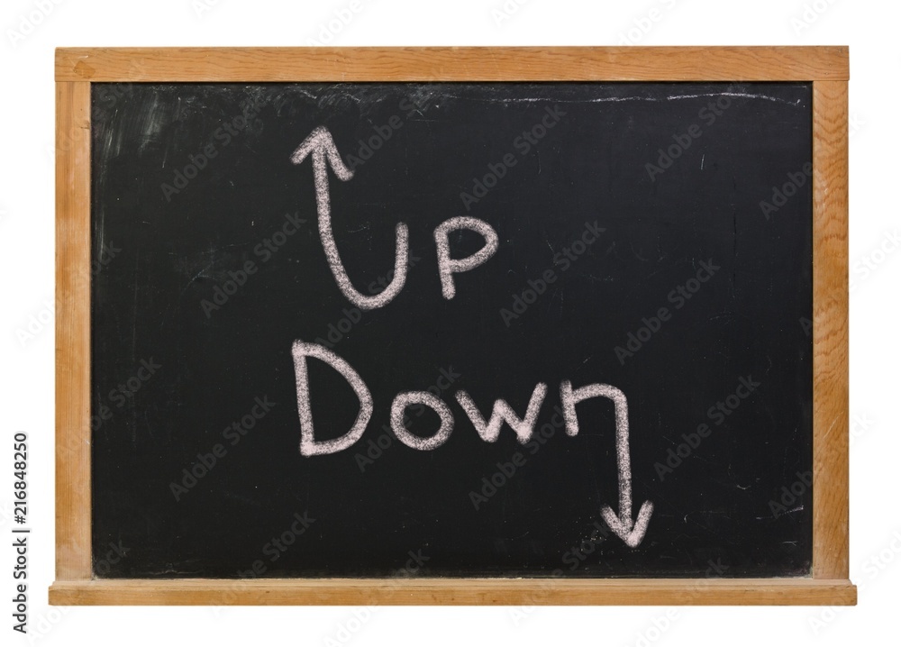 Up Down with arrows written in white chalk on a black chalkboard isolated on white Up Down with arrows written in white chalk on a black chalkboard isolated on white