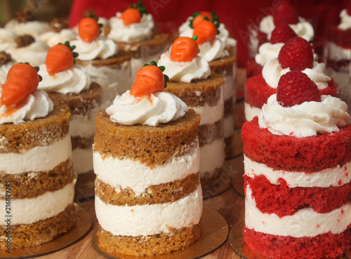 bright mini cakes with cream decoration close up