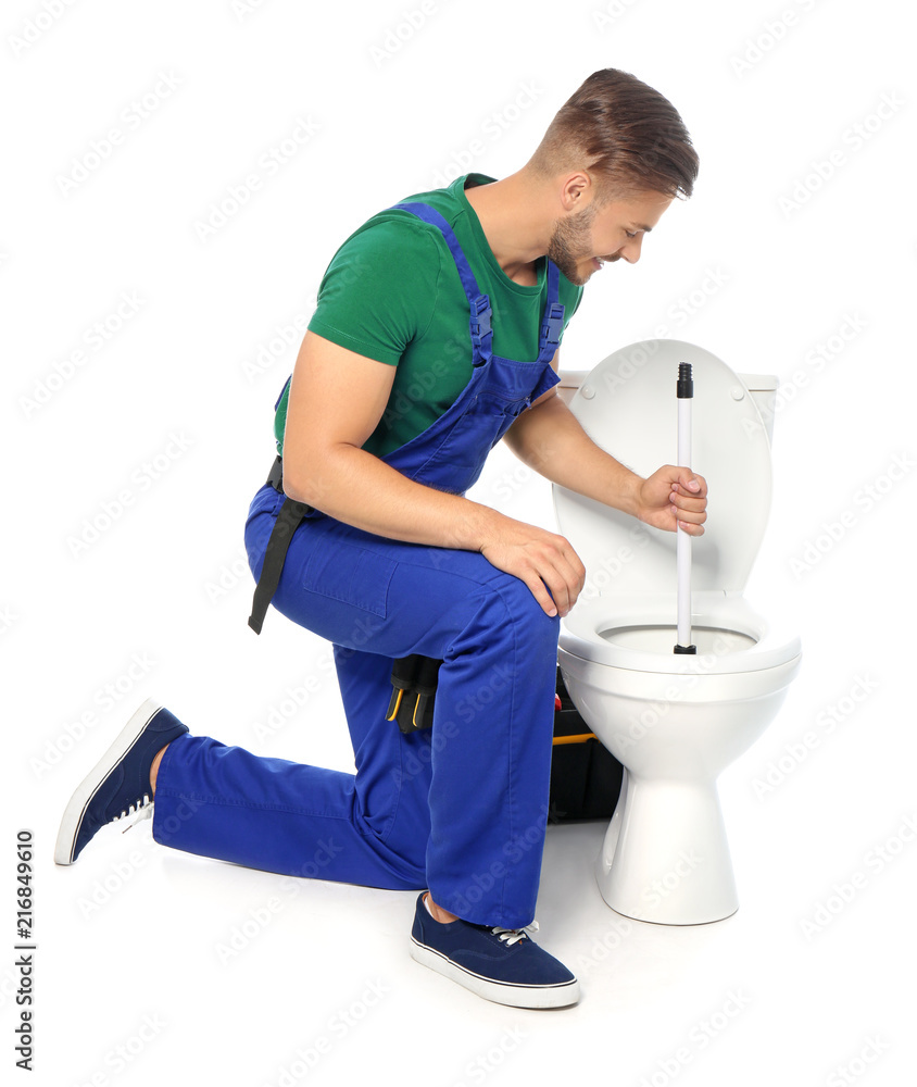Young man working with toilet bowl, isolated on white