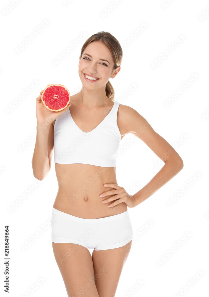 Happy slim woman in underwear holding grapefruit on white background. Weight loss diet Happy slim woman in underwear holding grapefruit on white background. Weight loss diet
