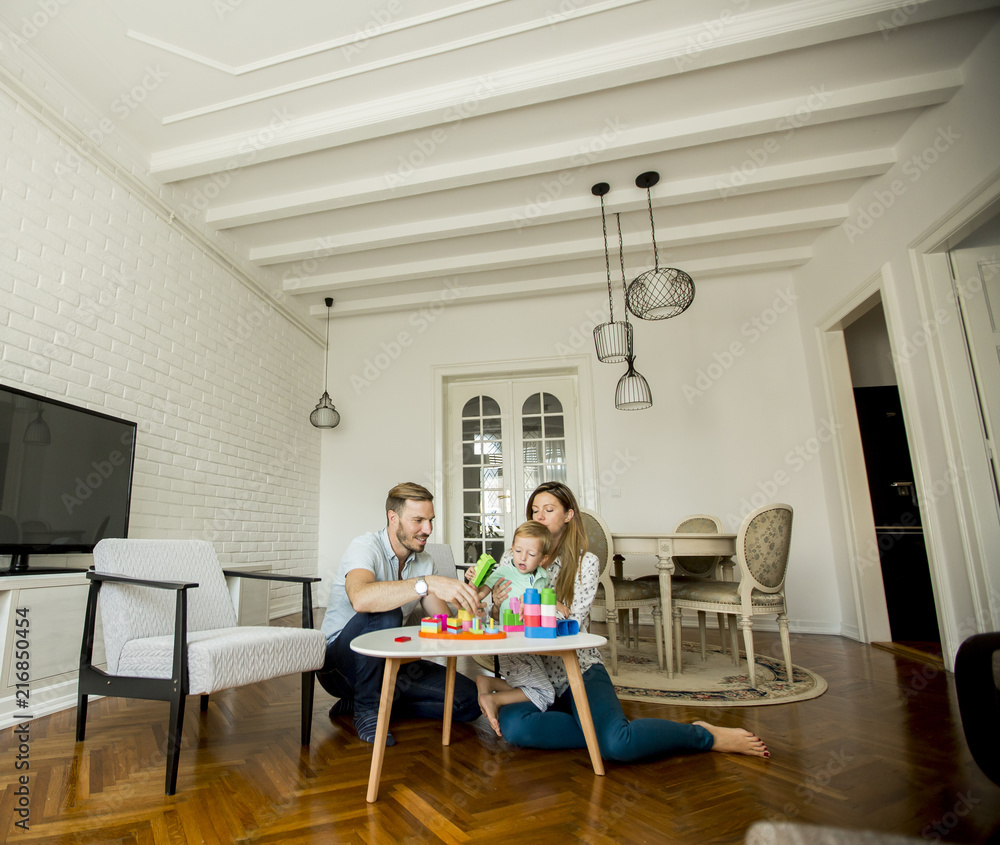 Happy family playing in the living room Happy family playing in the living room