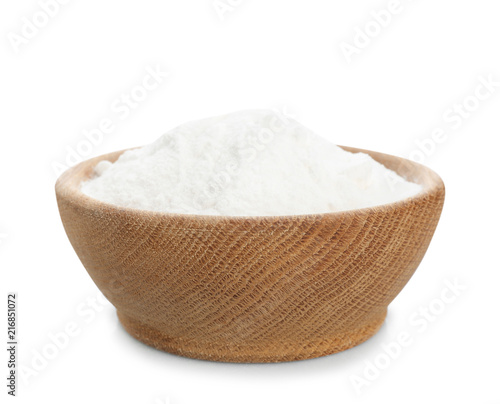 Wooden bowl with baking soda on white background