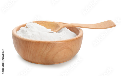 Wooden bowl with baking soda on white background