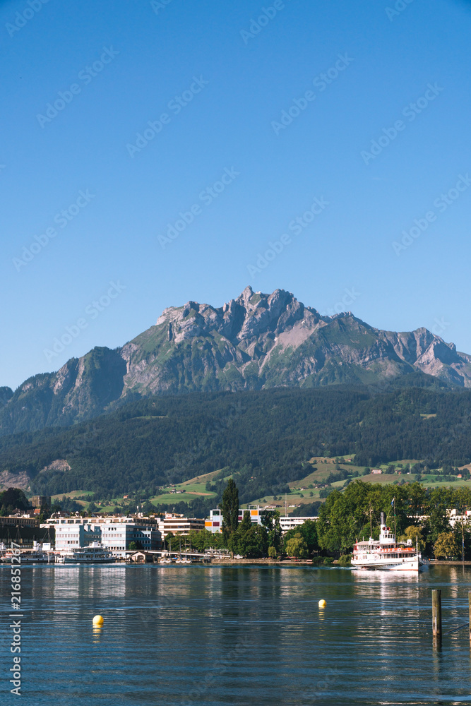 view of Lake Lucerne, the summer season, boats and ships, travel and vacation to Europe concept, Luzern, Switzerland, Pilatus mountain, vertical photo
