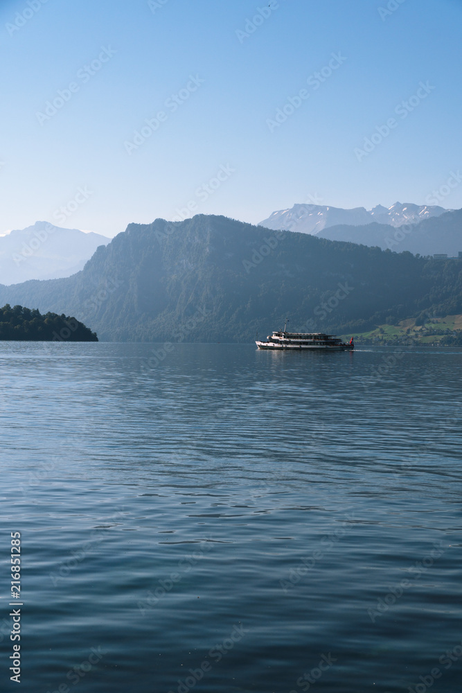 view of Lake Lucerne, the summer season, boats and ships, travel and vacation to Europe concept, Luzern, Switzerland, vertical photo