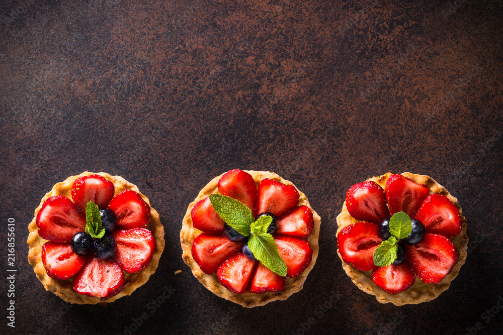 Strawberry tart on dark table. Top view. - obrazy, fototapety, plakaty 