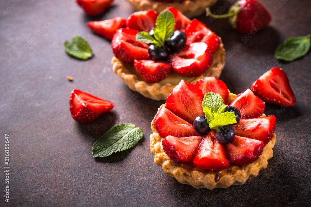 Strawberry tart on dark table. Strawberry tart on dark table.
