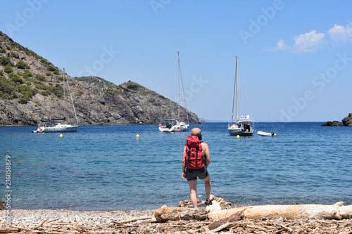 excursion woman near the sea, Cap de Creus, La Taballera beach, Girona province,Spain