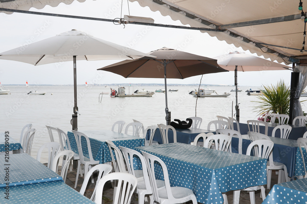 restaurant terrace at an oyster farmer at the foot of the ocean to eat oysters