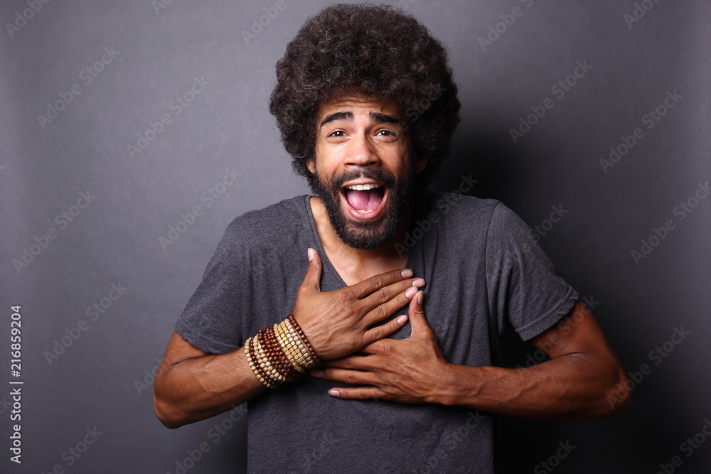 Afro man in front of a grey background Afro man in front of a grey background