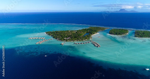 Fototapeta Naklejka Na Ścianę i Meble -  Water bungalows resort at islands, french polynesia in aerial view