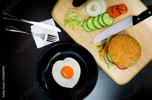Hamburger with Egg Lettuce and Tomato.