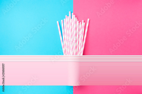 Stacked Drinking Paper Cups with Striped Straws on Duo Tone Mint Blue Pink Background. Flat Lay. Birthday Party Celebration Kids Fun. Greeting Card Poster Template. Copy Space. Pixel stretch glitch