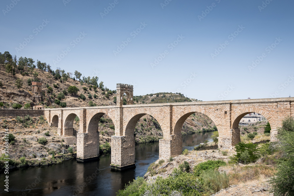 Roman bridge over the Tagus River in the city of Alcantara (Caceres, Spain)